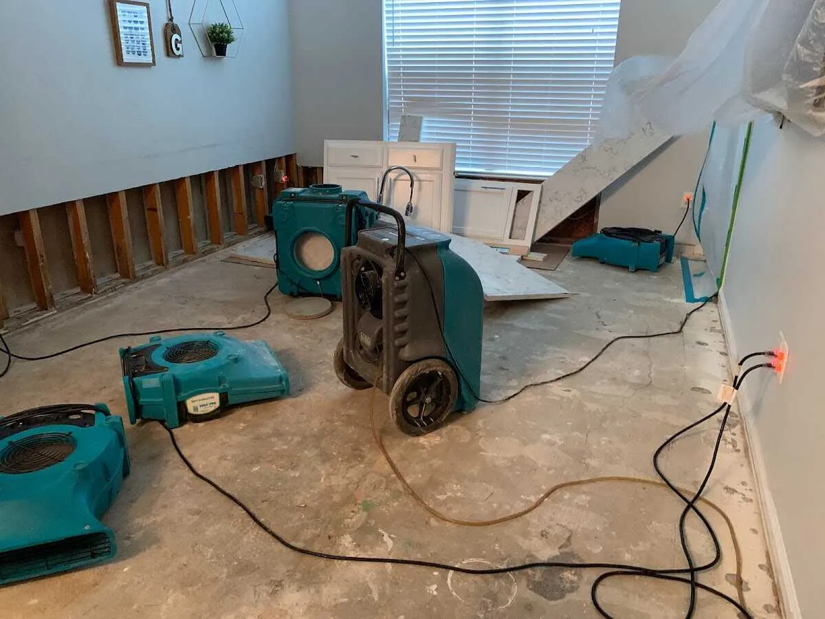 Dehumidifier in flood-cut room for Water Damage Restoration in Porters Neck